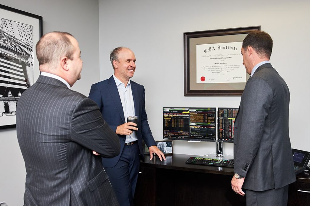 3 Men standing having a conversation